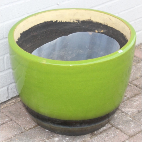 377 - A lime green glazed and brown banded ceramic garden pot, approx 51cm in diameter x 40cm tall