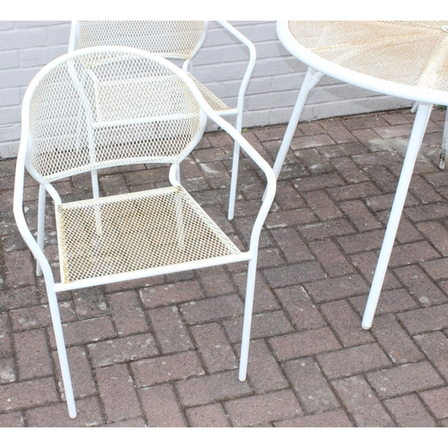 382 - A white painted wirework garden table and 4 chairs, the table approx 100cm in diameter x 72cm tall