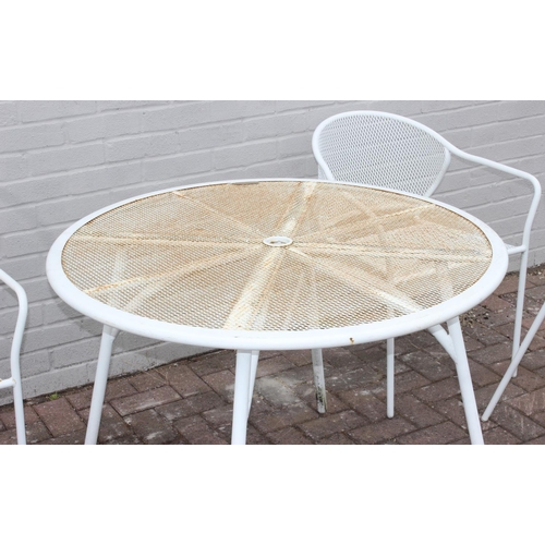 382 - A white painted wirework garden table and 4 chairs, the table approx 100cm in diameter x 72cm tall