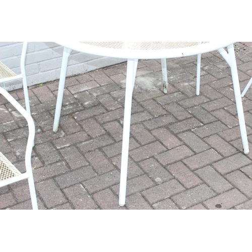 382 - A white painted wirework garden table and 4 chairs, the table approx 100cm in diameter x 72cm tall