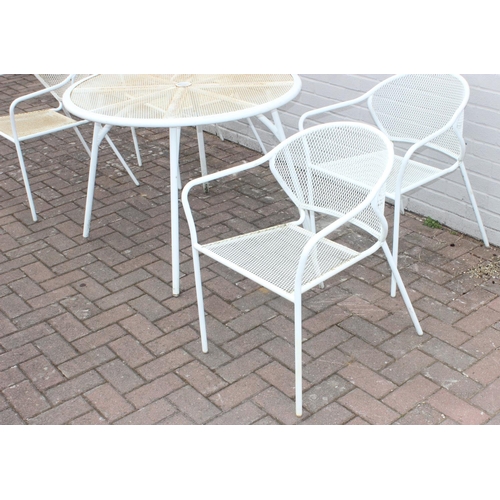 382 - A white painted wirework garden table and 4 chairs, the table approx 100cm in diameter x 72cm tall