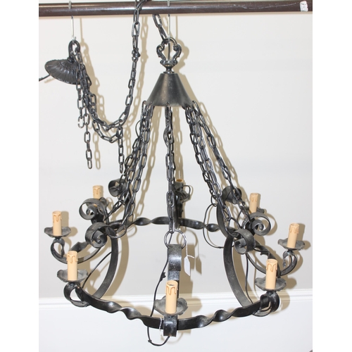 238 - A large 8 branch wrought iron hanging chandelier, approx 90cm in diameter, approx drop 167cm