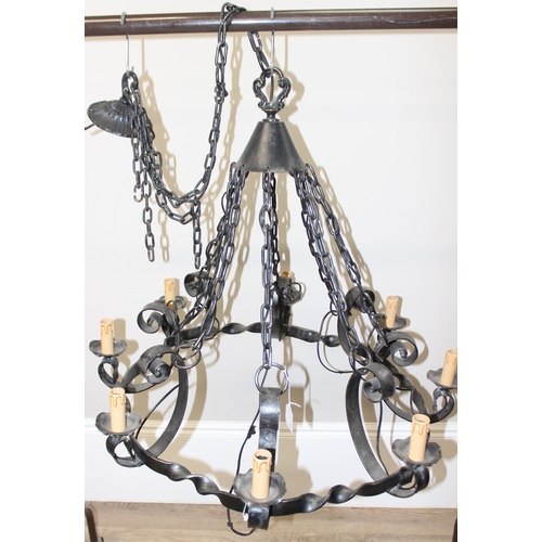 238 - A large 8 branch wrought iron hanging chandelier, approx 90cm in diameter, approx drop 167cm