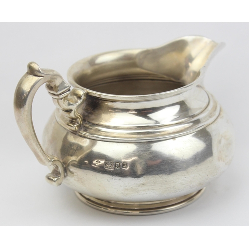 1002 - A vintage silver 2 handled milk or cream jug, London 1932 by Edward Barnard & Sons Ltd, approx 14cm ... 