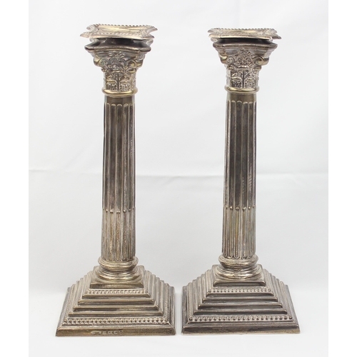 1005 - A pair of large and impressive silver Corinthian column candlesticks, marked for Birmingham 1935, ea... 