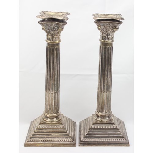 1005 - A pair of large and impressive silver Corinthian column candlesticks, marked for Birmingham 1935, ea... 