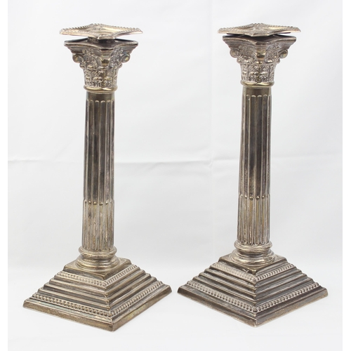 1005 - A pair of large and impressive silver Corinthian column candlesticks, marked for Birmingham 1935, ea... 