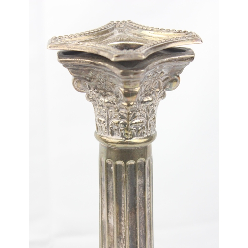 1005 - A pair of large and impressive silver Corinthian column candlesticks, marked for Birmingham 1935, ea... 