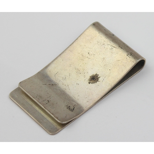 1011 - A vintage silver money clip with engine turned decoration, Birmingham 1985, approx 50mm wide, approx... 