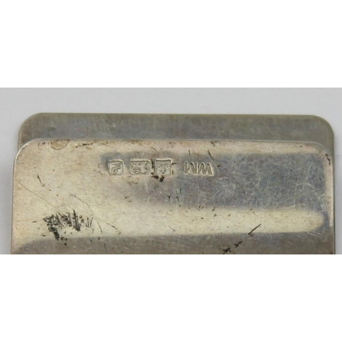 1011 - A vintage silver money clip with engine turned decoration, Birmingham 1985, approx 50mm wide, approx... 