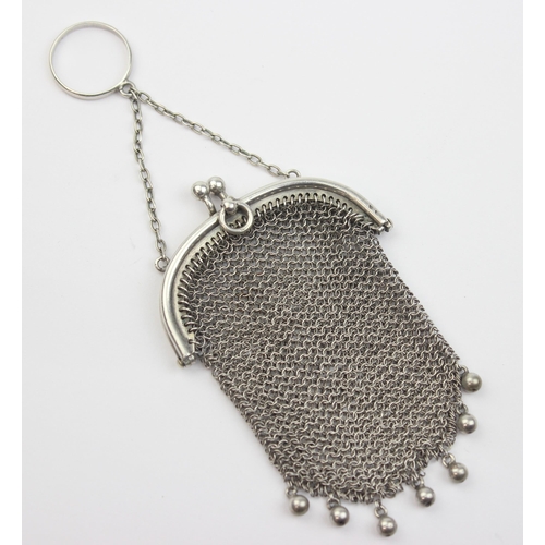 1013 - An early 20th century silver chainmail purse with suspension ring, indistinctly marked but XRF confi... 