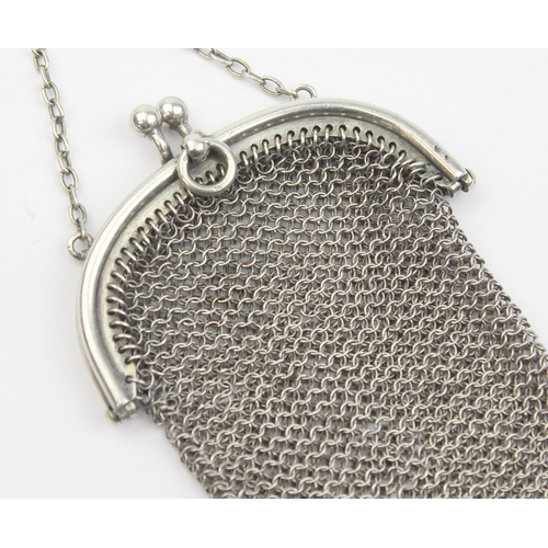 1013 - An early 20th century silver chainmail purse with suspension ring, indistinctly marked but XRF confi... 