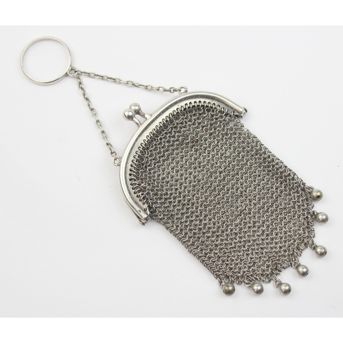 1013 - An early 20th century silver chainmail purse with suspension ring, indistinctly marked but XRF confi... 