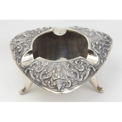 1026 - A vintage Siamese silver ashtray with embossed decoration, approx 10cm wide, marked Siam Sterling an... 