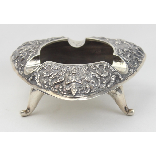 1026 - A vintage Siamese silver ashtray with embossed decoration, approx 10cm wide, marked Siam Sterling an... 