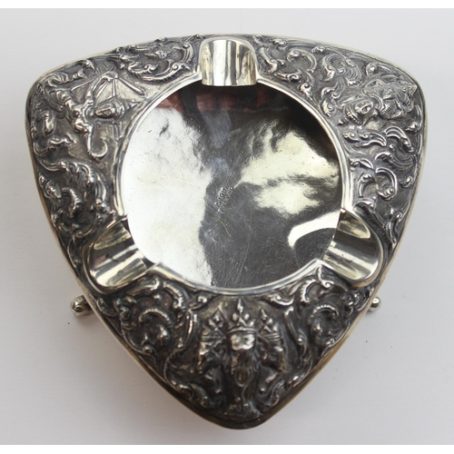 1026 - A vintage Siamese silver ashtray with embossed decoration, approx 10cm wide, marked Siam Sterling an... 