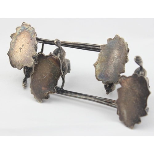 1029 - A pair of antique silver plated knife rests formed as a pair of horses jumping a 3 bar fence, each u... 