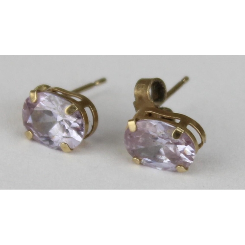 1113 - A pair of 9ct gold and amethyst stud earrings, seemingly unmarked but XRF tested as 9ct gold, approx... 