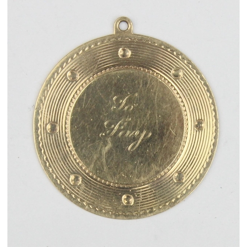 1123 - A 14ct gold engraved pendant, marked 14k and XRF confirmed, approx 32mm in diameter, approx 6.61g gr... 