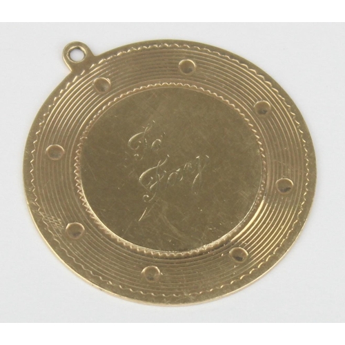 1123 - A 14ct gold engraved pendant, marked 14k and XRF confirmed, approx 32mm in diameter, approx 6.61g gr... 