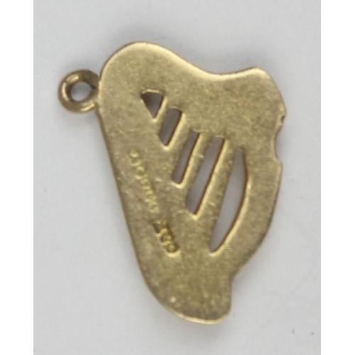 1134 - A vintage 9ct gold pendant or charm formed as an Irish harp, marked and XRF confirmed, approx 0.86g ... 