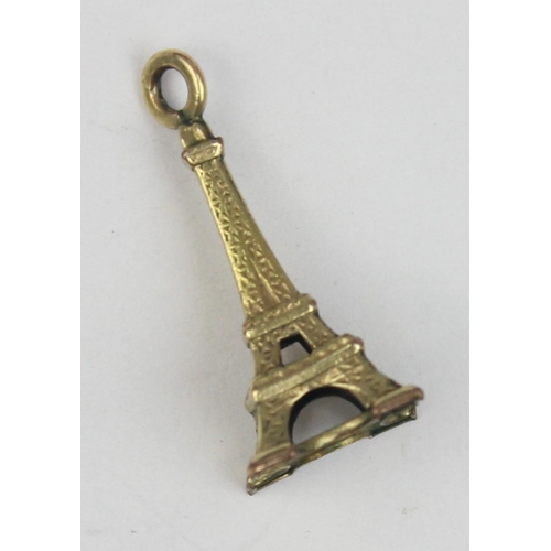 1135 - A vintage 9ct gold pendant or charm formed as the Eiffel Tower, XRF confirmed, approx 0.64g gross