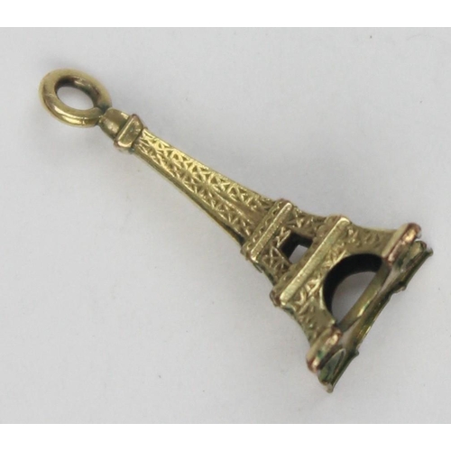 1135 - A vintage 9ct gold pendant or charm formed as the Eiffel Tower, XRF confirmed, approx 0.64g gross