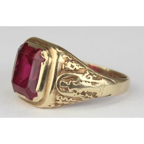 1144 - A vintage 9ct gold signet ring set with large pink stone and engraved shoulders, marked 9ct and XRF ... 