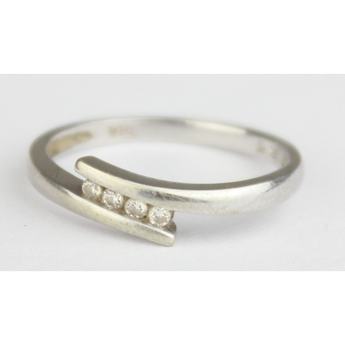 1148 - A 9ct white gold and 4 diamond ring in retro crossover setting, marked and XRF confirmed, approx siz... 