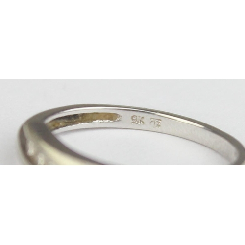 1148 - A 9ct white gold and 4 diamond ring in retro crossover setting, marked and XRF confirmed, approx siz... 