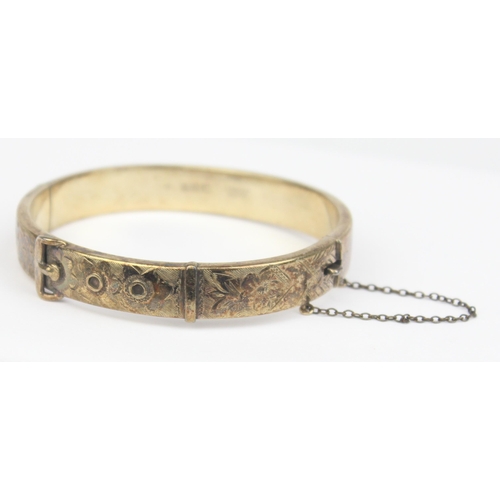 1153 - A mid-century silver gilt cuff bangle formed as a belt, marked for Birmingham 1971, marked 22ct gold... 