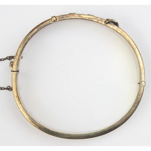 1153 - A mid-century silver gilt cuff bangle formed as a belt, marked for Birmingham 1971, marked 22ct gold... 