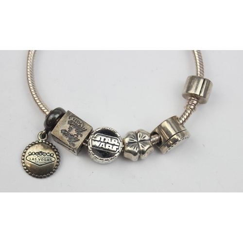 1155 - A genuine Pandora silver charm bracelet with 5 charms to inc Star Wars & Las Vegas related and 3 925... 