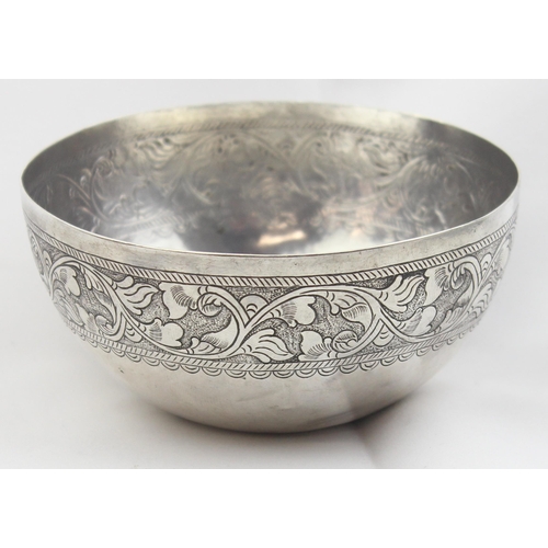 1025 - A rounded bottom silver bowl with floral scroll decoration, seemingly unmarked but XRF confirmed as ... 