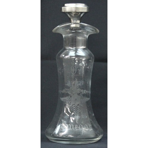 1027 - An antique silver topped oil and vinegar bottle, the glass body with engraved decoration, the top ma... 