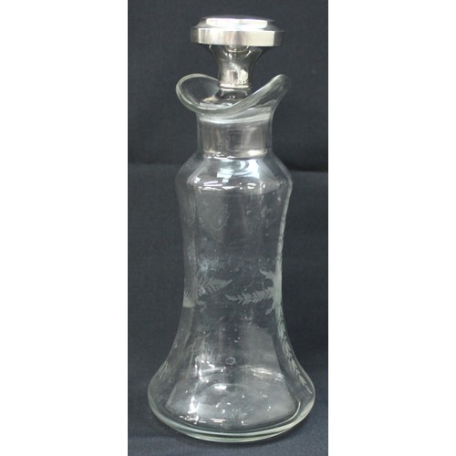 1027 - An antique silver topped oil and vinegar bottle, the glass body with engraved decoration, the top ma... 