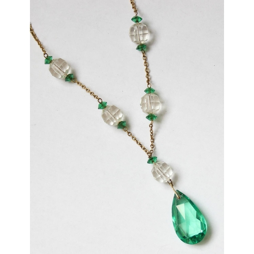 1164 - An antique 9ct gold chain necklace set with green and white cut glass beads, the chain marked 9c and... 