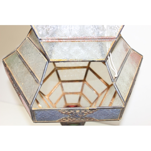 240 - A large Moroccan style hanging lamp with colourful glass panels and metal frame, approx 70cm tall