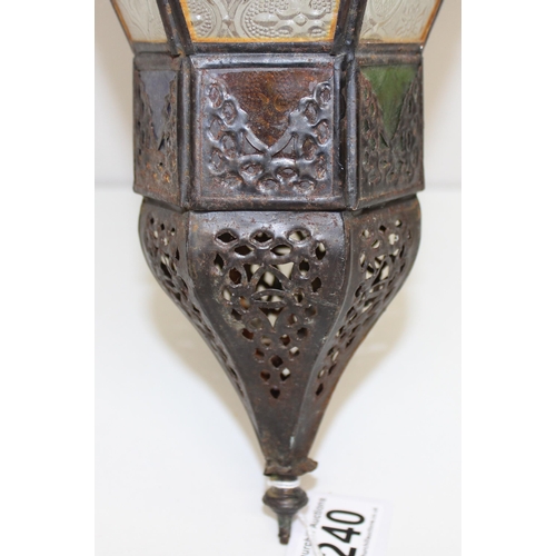 240 - A large Moroccan style hanging lamp with colourful glass panels and metal frame, approx 70cm tall