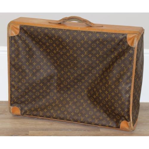 273 - A genuine Louis Vuitton leather and monogrammed suitcase, inscribed in gilt 'DE