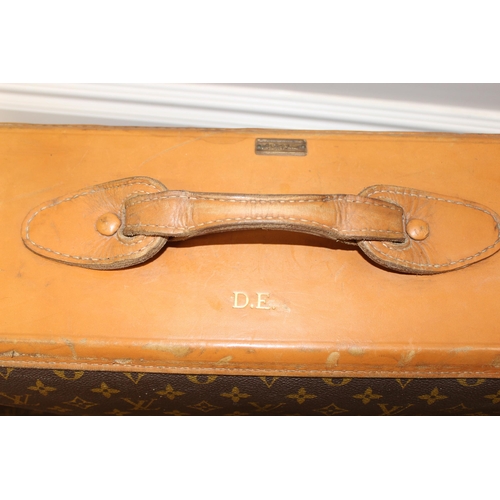 273 - A genuine Louis Vuitton leather and monogrammed suitcase, inscribed in gilt 'DE