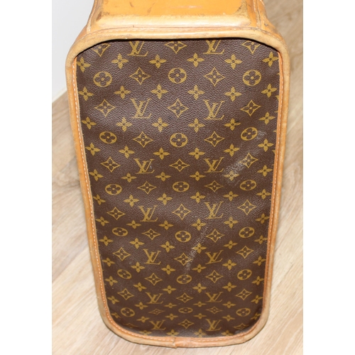 273 - A genuine Louis Vuitton leather and monogrammed suitcase, inscribed in gilt 'DE