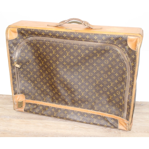 273 - A genuine Louis Vuitton leather and monogrammed suitcase, inscribed in gilt 'DE