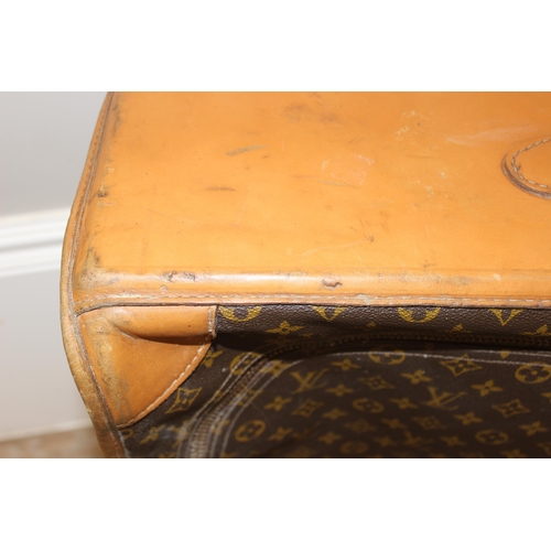 273 - A genuine Louis Vuitton leather and monogrammed suitcase, inscribed in gilt 'DE