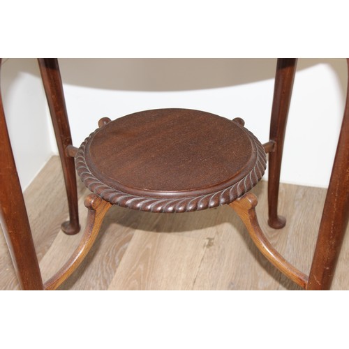 144 - An Edwardian mahogany side table of circular form with rope twist border, approx 63cm in diameter x ... 