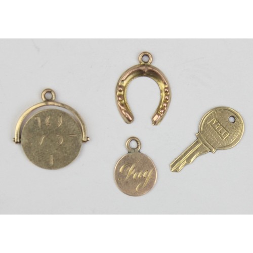 1136 - 4 assorted vintage 9ct gold pendants or charms formed as a key, a revolving I Love You fob, a horses... 