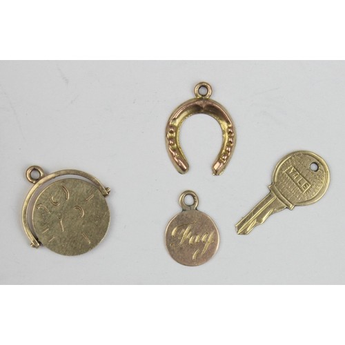 1136 - 4 assorted vintage 9ct gold pendants or charms formed as a key, a revolving I Love You fob, a horses... 