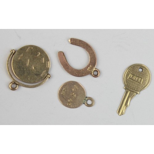 1136 - 4 assorted vintage 9ct gold pendants or charms formed as a key, a revolving I Love You fob, a horses... 