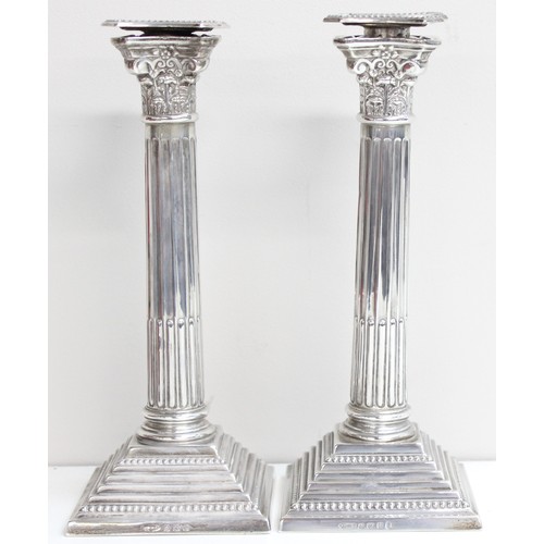 1005 - A pair of large and impressive silver Corinthian column candlesticks, marked for Birmingham 1935, ea... 