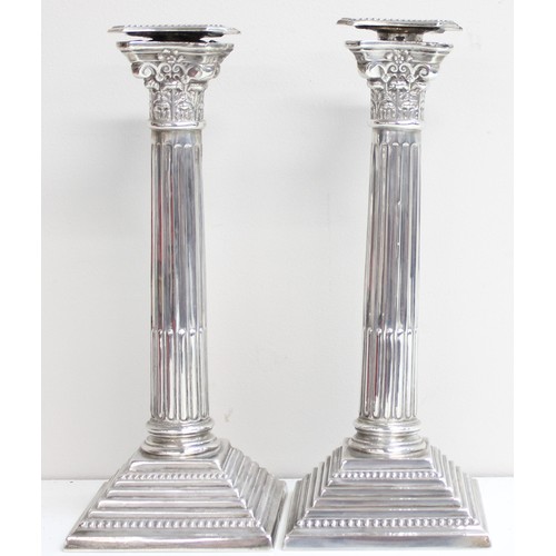 1005 - A pair of large and impressive silver Corinthian column candlesticks, marked for Birmingham 1935, ea... 